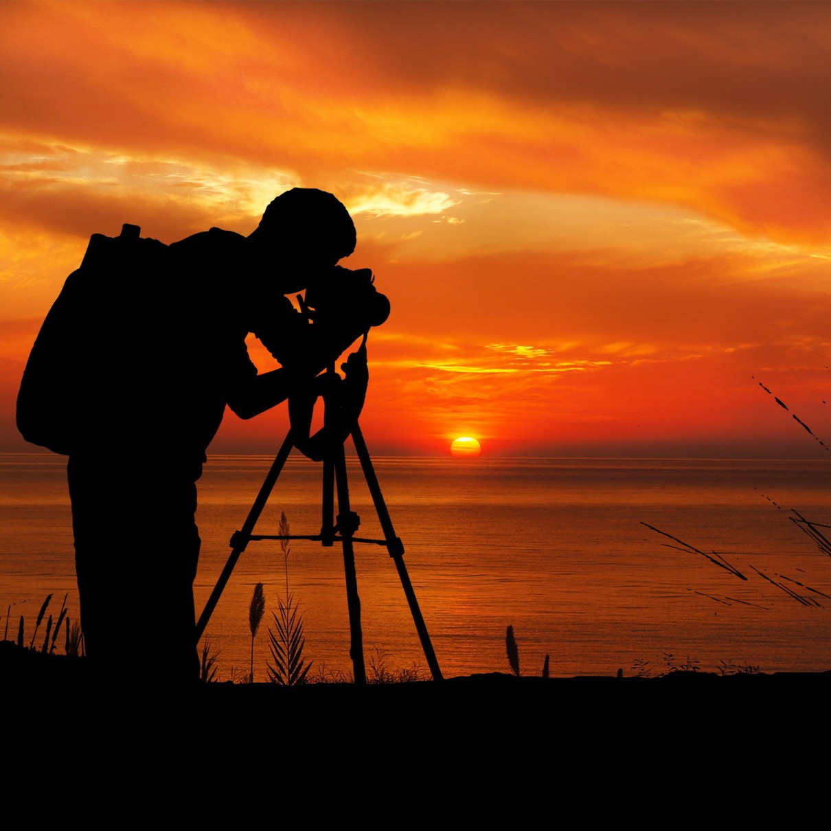 Photographer capturing a warm South Florida sunset during a private outdoor lesson